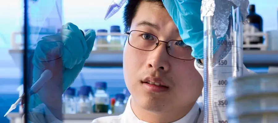 laboratory worker handles a pipette