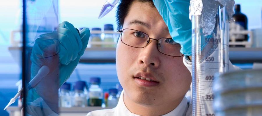 laboratory worker handles a pipette