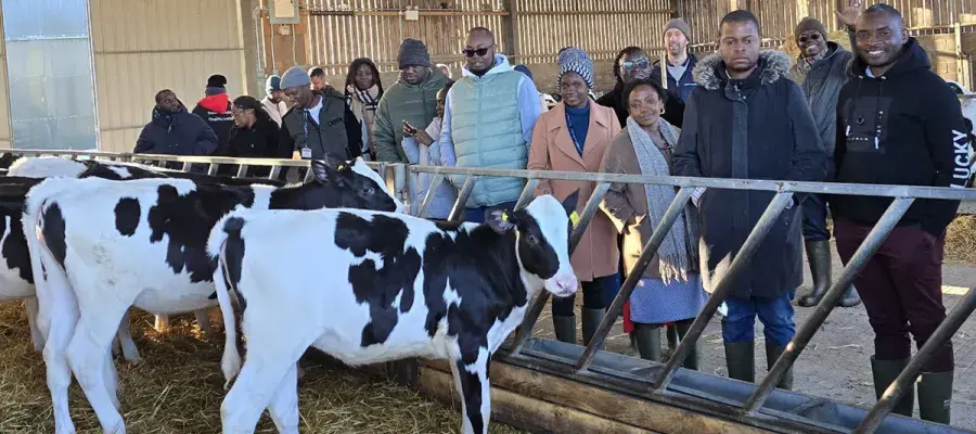 Group of people in a dairy farm