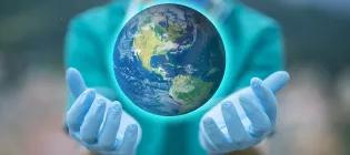 Hands holding a world globe