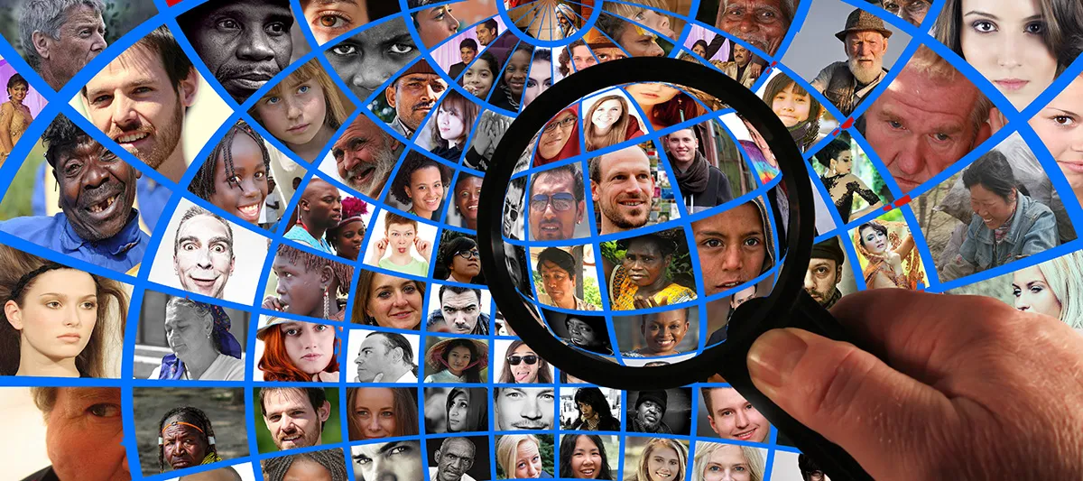 Group of people under magnifying glass