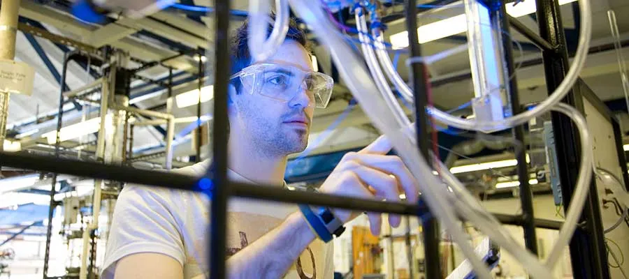 Photo of a student researching in lab