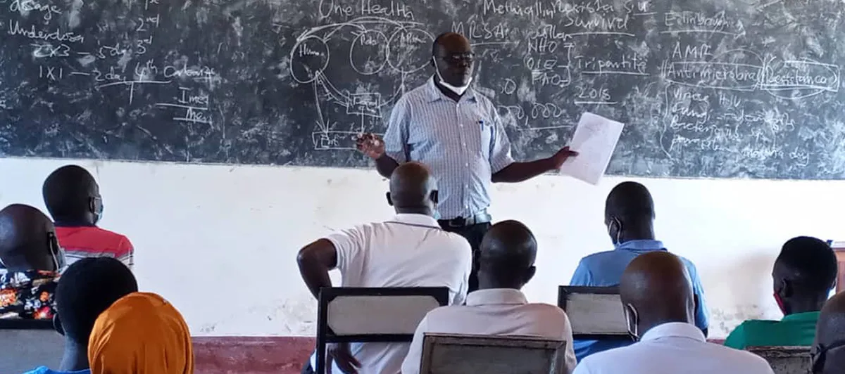 Christopher Harold Amandu giving a presentation at the Arua Institute of Health Sciences.