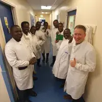 Fleming Fund Fellows on a tour of a lab