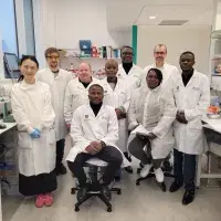 Fleming Fund Fellows on a tour of a lab