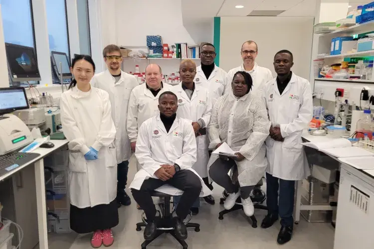 Fleming Fund Fellows on a tour of a lab
