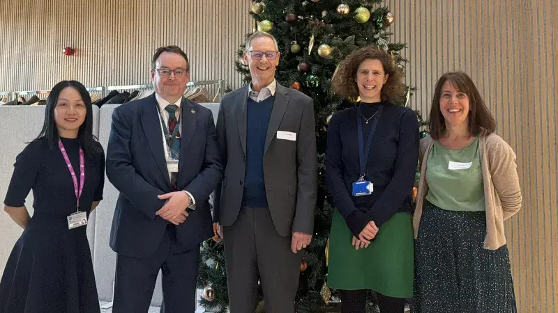 Group of people by a Christmas tree