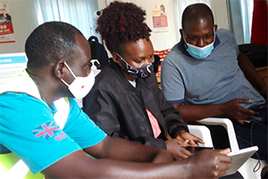 Lab workers learning about the new tool