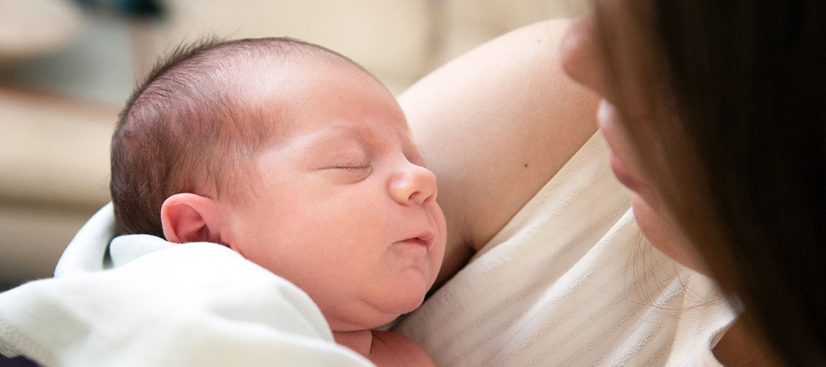 Baby sleeping with mother